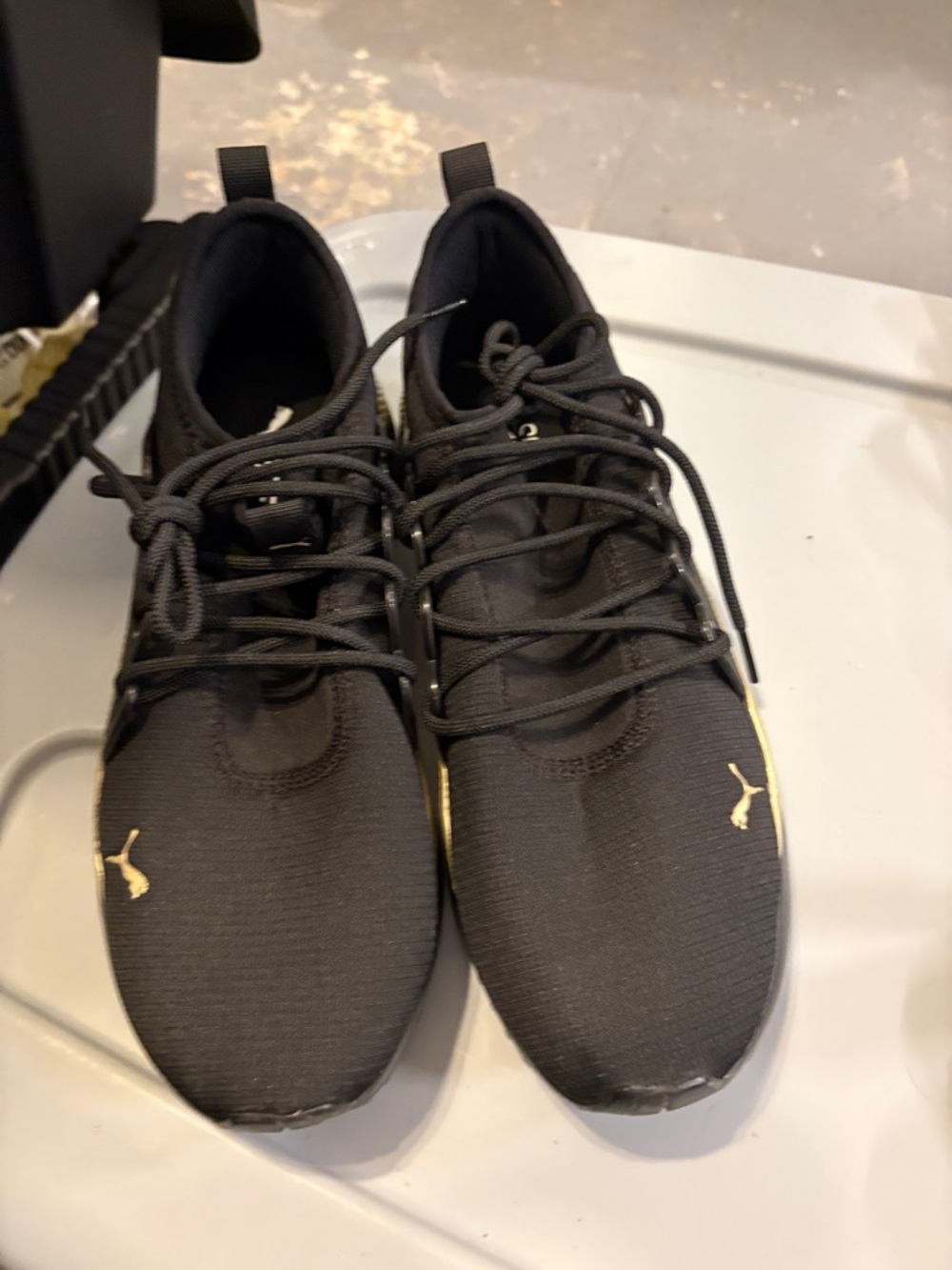 Puma Men’s Black Athletic Sneakers with Gold Logo Accents